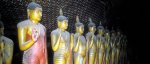 Standing Buddha figures in caves at Raja Maha Vihara, Sri Lanka